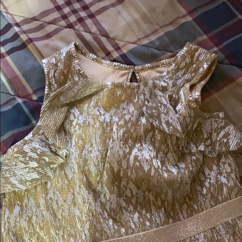 A girls occasion dress; sleeveless with ruffles